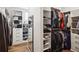 Organized walk-in closet with shelving for clothes, shoes, and accessories at 2977 Treeside Ter, Marietta, GA 30066