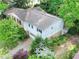 Aerial view of two-story home and landscaping, with driveway leading to an attached two car garage at 3844 Lake Se Dr, Smyrna, GA 30082