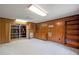 Spacious basement featuring built-in shelving, wood paneling, and ample storage at 3844 Lake Se Dr, Smyrna, GA 30082