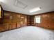 Spacious basement featuring wall paneling and built-in cabinets, perfect for a recreation area at 3844 Lake Se Dr, Smyrna, GA 30082