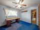 Well-lit bedroom featuring a fan and desk, perfect for a home office at 3844 Lake Se Dr, Smyrna, GA 30082