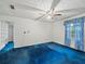 Bedroom featuring a ceiling fan and a large walk-in closet, providing ample storage at 3844 Lake Se Dr, Smyrna, GA 30082