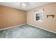 Cozy bedroom with carpet floors, natural lighting, and a small shelf at 3844 Lake Se Dr, Smyrna, GA 30082