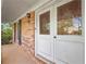 Charming front entrance showcasing brick facade and decorative glass door at 3844 Lake Se Dr, Smyrna, GA 30082