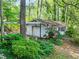 Detached one car garage, surrounded by mature trees and lush greenery at 3844 Lake Se Dr, Smyrna, GA 30082