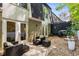 Backyard patio features lovely patio furniture, a privacy fence, and a grill at 5250 Chemin De Vie, Atlanta, GA 30342