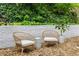 Backyard patio with bistro set and privacy wall with beautiful foliage at 5250 Chemin De Vie, Atlanta, GA 30342