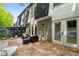 Exterior view of backyard patio with outdoor furniture, a privacy fence and brick siding at 5250 Chemin De Vie, Atlanta, GA 30342
