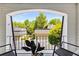 Relaxing balcony offers views of neighborhood and landscaping at 5250 Chemin De Vie, Atlanta, GA 30342