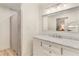 Bright bathroom features a modern vanity with marble countertop and a shower with glass doors at 5250 Chemin De Vie, Atlanta, GA 30342