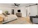 Spacious bedroom boasting great light, wood floors, and a barn door to the bathroom at 5250 Chemin De Vie, Atlanta, GA 30342