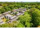 Exterior view of townhome complex with ample parking and lots of surrounding greenery at 5250 Chemin De Vie, Atlanta, GA 30342