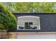 Exterior view of home with black shingled roof and a balcony off the second story at 5250 Chemin De Vie, Atlanta, GA 30342
