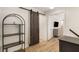 Stylish hallway with sliding barn door, shelving unit, and views to the next room at 5250 Chemin De Vie, Atlanta, GA 30342