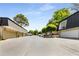 Community street view shows well-maintained homes, mature trees and easy parking at 5250 Chemin De Vie, Atlanta, GA 30342