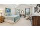Relaxing bedroom features a queen bed, vaulted ceilings, a dresser, and is well-lit at 6103 Menlow Ct, Cumming, GA 30041