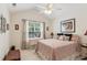Charming bedroom with a ceiling fan, and pretty decor accents create a serene atmosphere at 6103 Menlow Ct, Cumming, GA 30041
