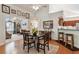 Formal dining area features French doors, hardwood floors, and is connected to the kitchen at 6103 Menlow Ct, Cumming, GA 30041