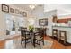 Formal dining area features French doors, hardwood floors, and is connected to the kitchen at 6103 Menlow Ct, Cumming, GA 30041
