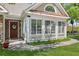 Charming front exterior showcasing a welcoming entrance with lush landscaping and plenty of natural light at 6103 Menlow Ct, Cumming, GA 30041