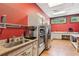 Bright kitchen with stainless steel appliances, granite countertops, and ample cabinet space for modern convenience at 6103 Menlow Ct, Cumming, GA 30041