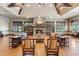 Cozy living room with a stone fireplace, comfortable seating, and built-in shelves for a relaxing atmosphere at 6103 Menlow Ct, Cumming, GA 30041