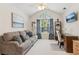 Cozy living room featuring a window and desk, perfect for relaxing and working at 6103 Menlow Ct, Cumming, GA 30041