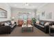 Spacious, well-lit living area featuring comfortable seating, perfect for relaxing at 6103 Menlow Ct, Cumming, GA 30041