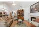 Bright and airy living room with hardwood floors, fireplace, and open layout at 6103 Menlow Ct, Cumming, GA 30041