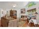Cozy living room with fireplace, hardwood floors, and ample natural light, perfect for relaxing at 6103 Menlow Ct, Cumming, GA 30041