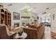 Cozy living room features a fireplace and lots of natural light from the arched window above the mantel at 6103 Menlow Ct, Cumming, GA 30041