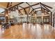 Expansive lounge with a fireplace, plenty of seating, and large windows at 6103 Menlow Ct, Cumming, GA 30041