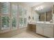 Bathroom with large window, white vanity, and ample counter space at 104 Glentown Way, Sandy Springs, GA 30328