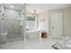 Bright bathroom with modern tub, patterned shower, and marble floors at 104 Glentown Way, Sandy Springs, GA 30328