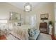 Cozy bedroom with neutral tones, a large mirror, and stylish furnishings at 104 Glentown Way, Sandy Springs, GA 30328