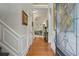 Inviting entryway with hardwood floors, decorative molding, and view into the living room at 104 Glentown Way, Sandy Springs, GA 30328