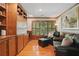 Cozy living room with wood floors, built-in shelving and leather furniture at 104 Glentown Way, Sandy Springs, GA 30328