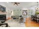 Spacious living room featuring a fireplace, hardwood floors, and natural light at 104 Glentown Way, Sandy Springs, GA 30328