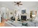 Comfortable living room with fireplace, hardwood floors, and access to other rooms at 104 Glentown Way, Sandy Springs, GA 30328