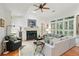 Cozy living room with hardwood floors, fireplace, and ample seating for relaxing at 104 Glentown Way, Sandy Springs, GA 30328