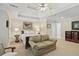 Large bedroom with sitting area, trey ceilings, and carpeted floors at 104 Glentown Way, Sandy Springs, GA 30328