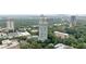 Scenic aerial view of high-rise condo building in a lush, green landscape with city skyline at 2870 Pharr Court South Nw # 1704, Atlanta, GA 30305