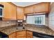 Kitchen showcasing granite countertops, stainless steel dishwasher and view from unit at 2870 Pharr Court South Nw # 1704, Atlanta, GA 30305