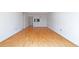 Hardwood floors lead into the living room with passthrough to kitchen at 2870 Pharr Court South Nw # 1704, Atlanta, GA 30305