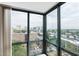 City skyline as seen through expansive floor-to-ceiling corner windows with great natural light at 2870 Pharr Court South Nw # 1704, Atlanta, GA 30305
