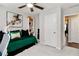Cozy bedroom featuring bright white walls, a plush green bed, and a stylish art piece at 371 Northaven Ave, Suwanee, GA 30024