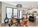 Bright dining area with a geometric accent wall and a view of the kitchen at 371 Northaven Ave, Suwanee, GA 30024