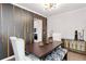 Modern dining room showcasing a stylish light fixture, decorative wall art, and hardwood flooring at 371 Northaven Ave, Suwanee, GA 30024
