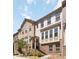 Attractive townhome displays a brick facade, large windows, and a welcoming entrance with landscaped surroundings at 371 Northaven Ave, Suwanee, GA 30024