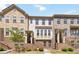 Charming brick townhome featuring multiple levels, classic architecture, and well-maintained landscaping at 371 Northaven Ave, Suwanee, GA 30024